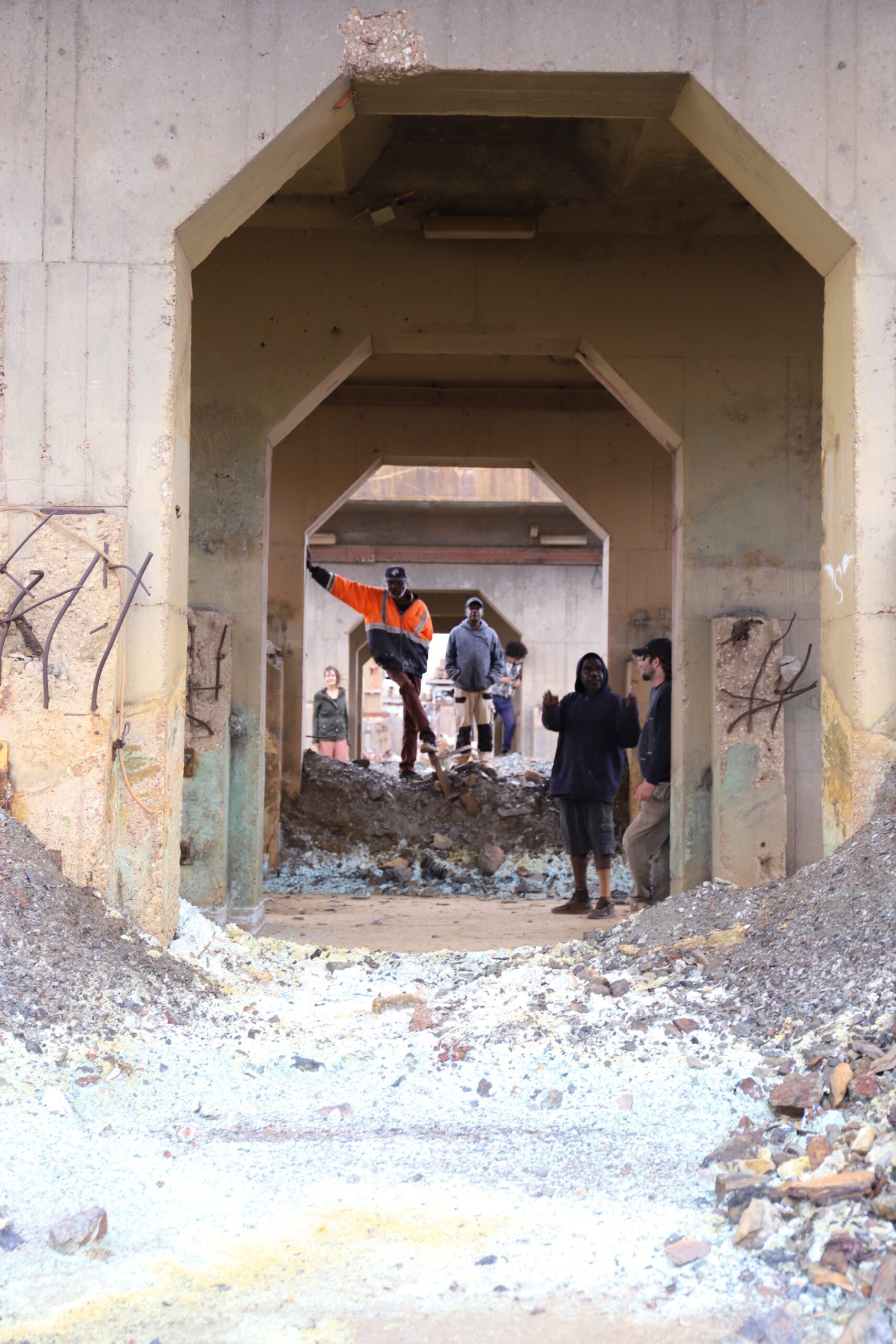 Members of Tennant Creek Brio at a derelict mine near Tennant Creek: Fabian Brown, Clifford Thompson, Lévi McLean, Simon Wilson, Rupert Betheras, with curator Erica Izett, Tennant Creek, NT 2022. Photograph: Harry Price